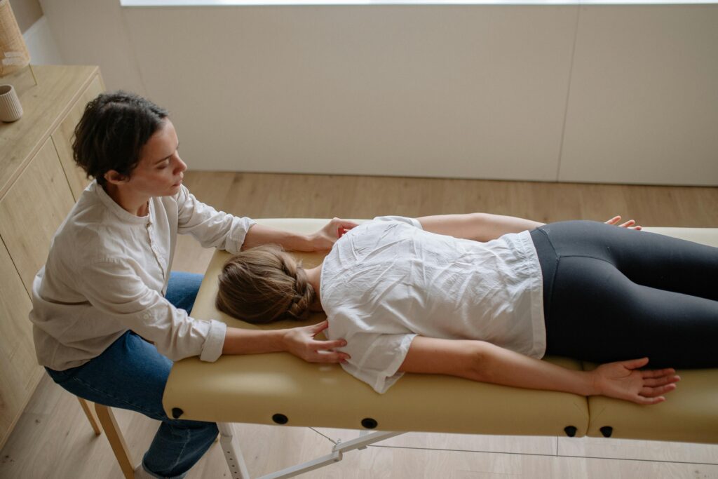 Chiropractor performing patient adjustment
